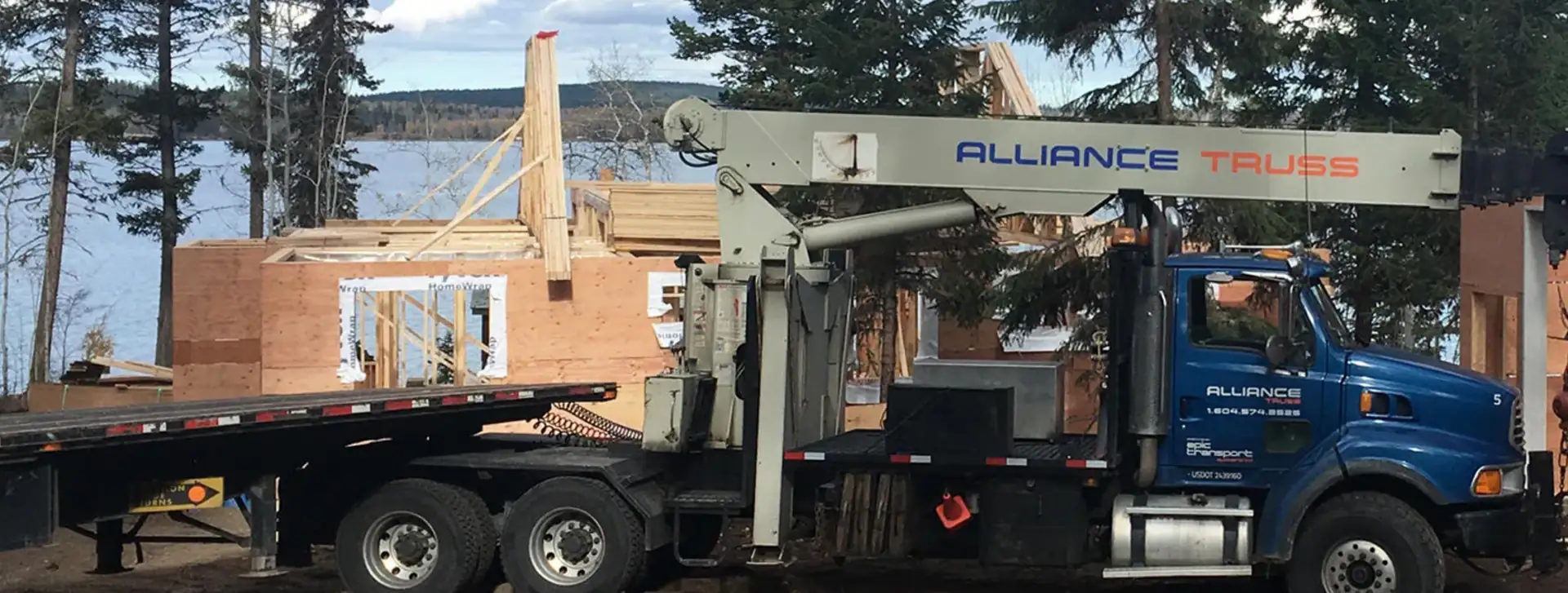 Alliance Truss flatbed truck loaded with sequenced roof trusses for delivery across BC